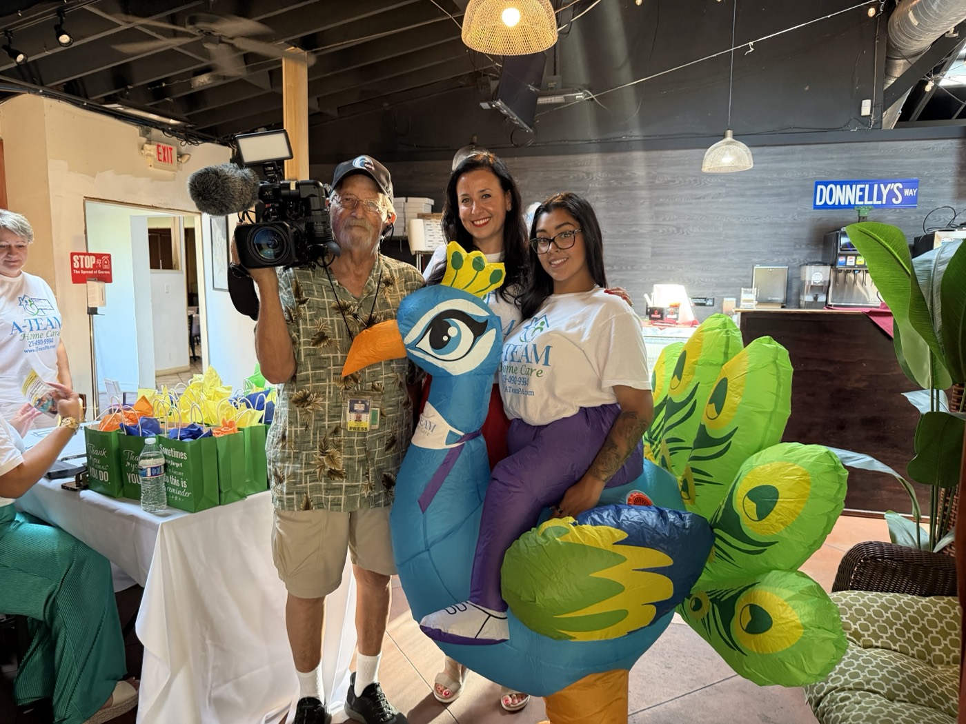 A-Team Home Care staff at the 2026 caregiver appreciation party in Somerton, Philadelphia, with a 6abc news crew filming